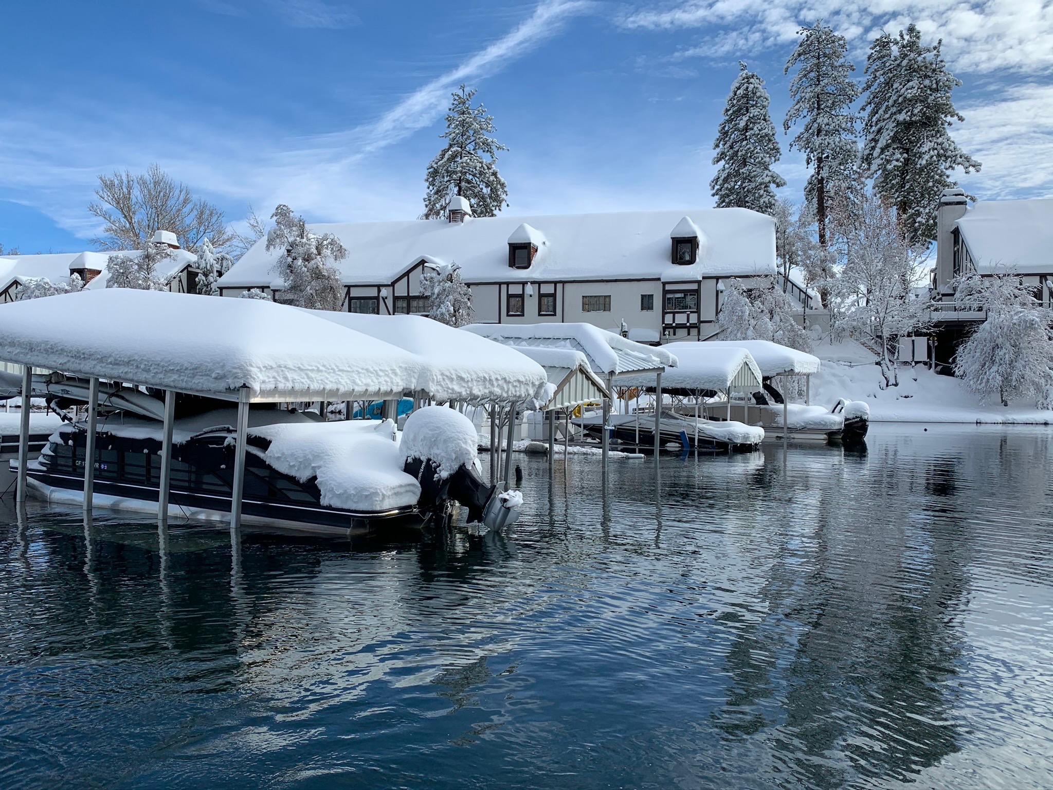 Snow Covered Dock Submerged in Lake